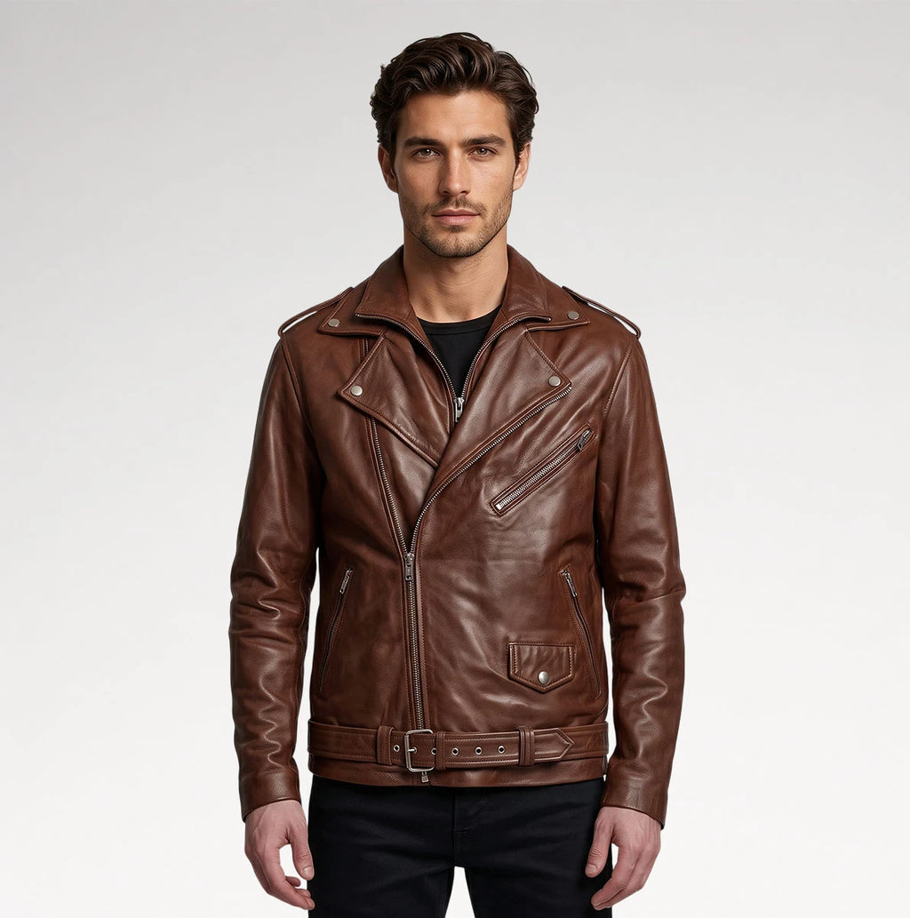 A man wearing a brown leather motorcycle jacket with a belted waist and silver hardware, photographed against a light gray studio background.