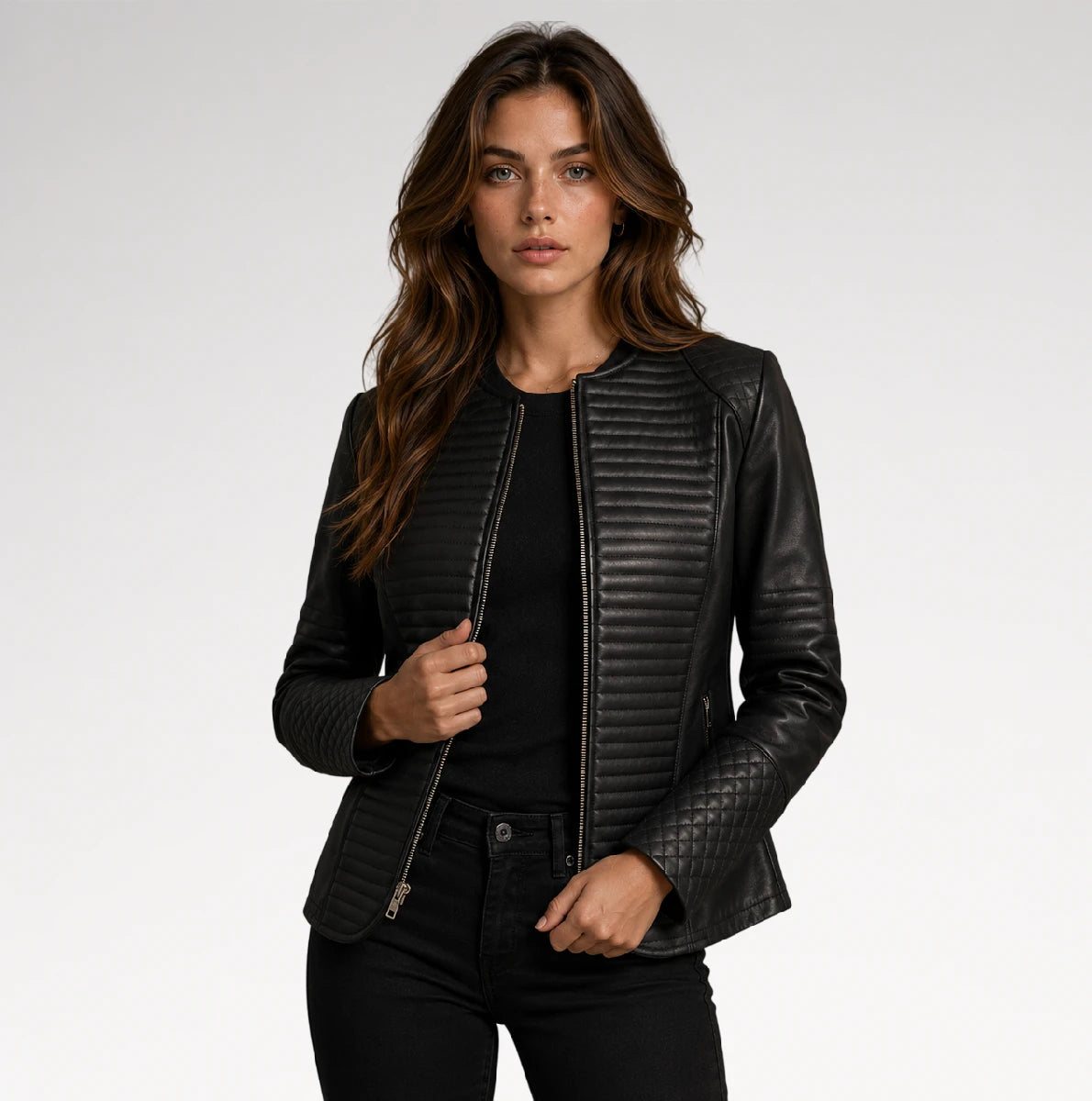 A woman modeling a black faux leather jacket with quilted and ribbed textures, styled over a black top and black pants against a light gray studio background. Main image