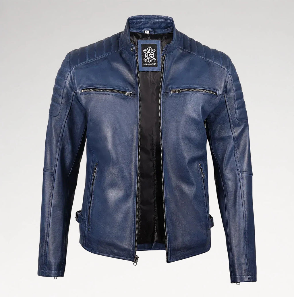 A men's blue leather motorcycle jacket with quilted shoulder panels, a stand collar, and zippered chest pockets, shown against a light gray background.