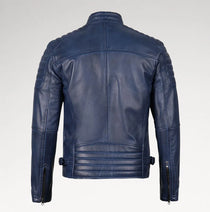 A navy blue leather jacket shown from the back, featuring quilted shoulder panels, a high collar, and zippered sleeve details, photographed against a light gray studio background.