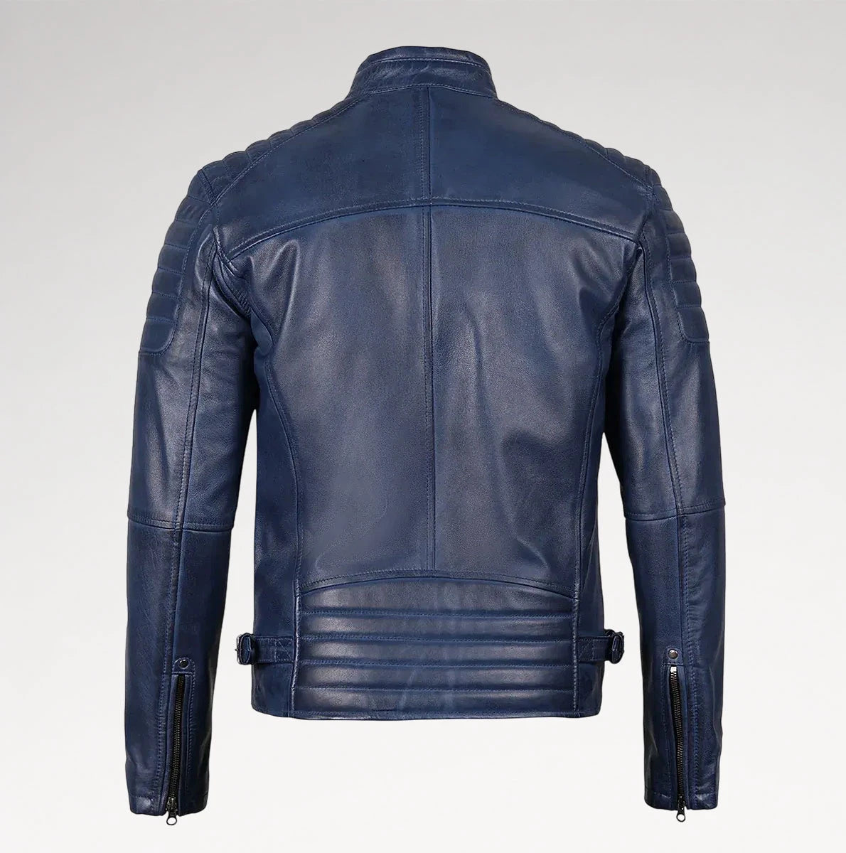 A navy blue leather jacket shown from the back, featuring quilted shoulder panels, a high collar, and zippered sleeve details, photographed against a light gray studio background.