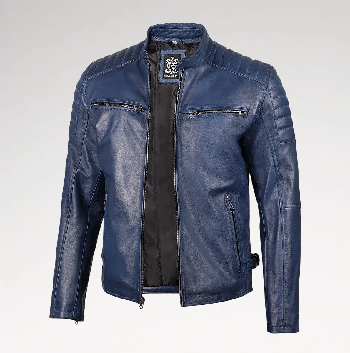 A blue leather motorcycle jacket with quilted shoulder panels, zippered chest pockets, and a black interior lining, shown on a light gray background.