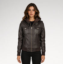 A woman modeling a dark brown faux-leather hooded jacket with silver-tone hardware, photographed against a light gray studio background.