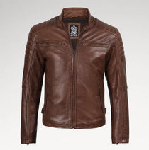 A brown leather jacket with a full zip front, stand-up collar, and quilted shoulder panels, shown on a light gray background.