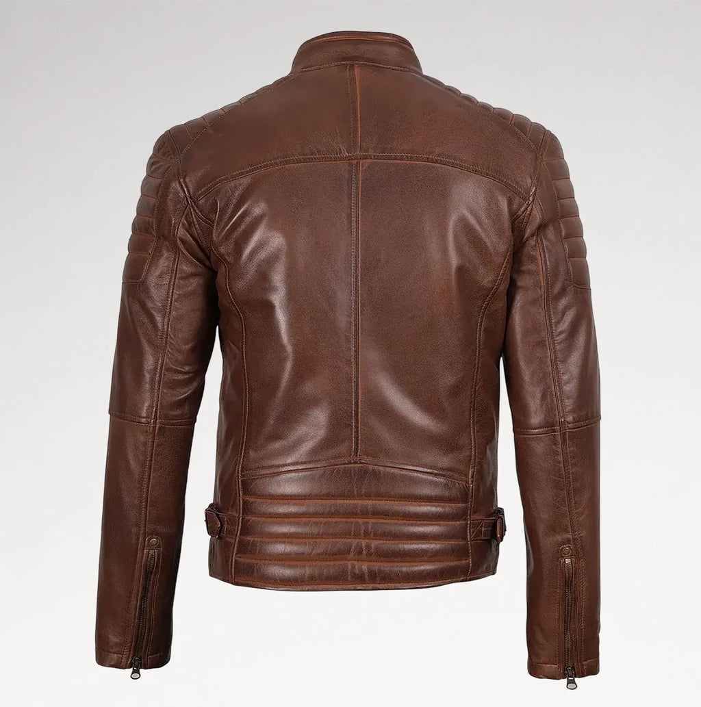 A brown leather motorcycle jacket shown from the back, featuring quilted shoulder panels, a high collar, and zippered side pockets, photographed against a light gray studio background.