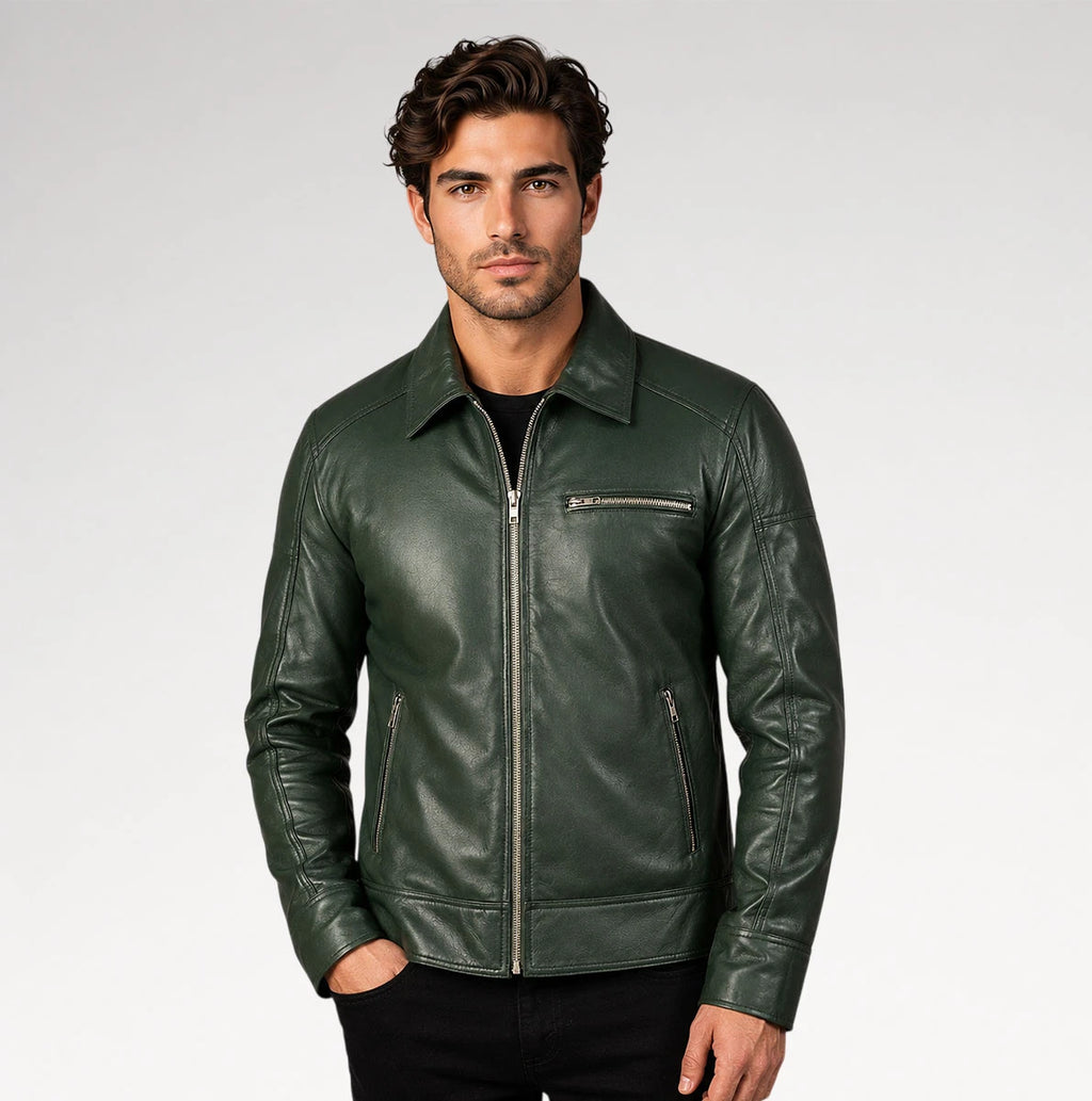 A man wearing a dark green leather jacket with a front zipper, zippered chest pocket, and zippered side pockets, photographed against a light gray studio background.