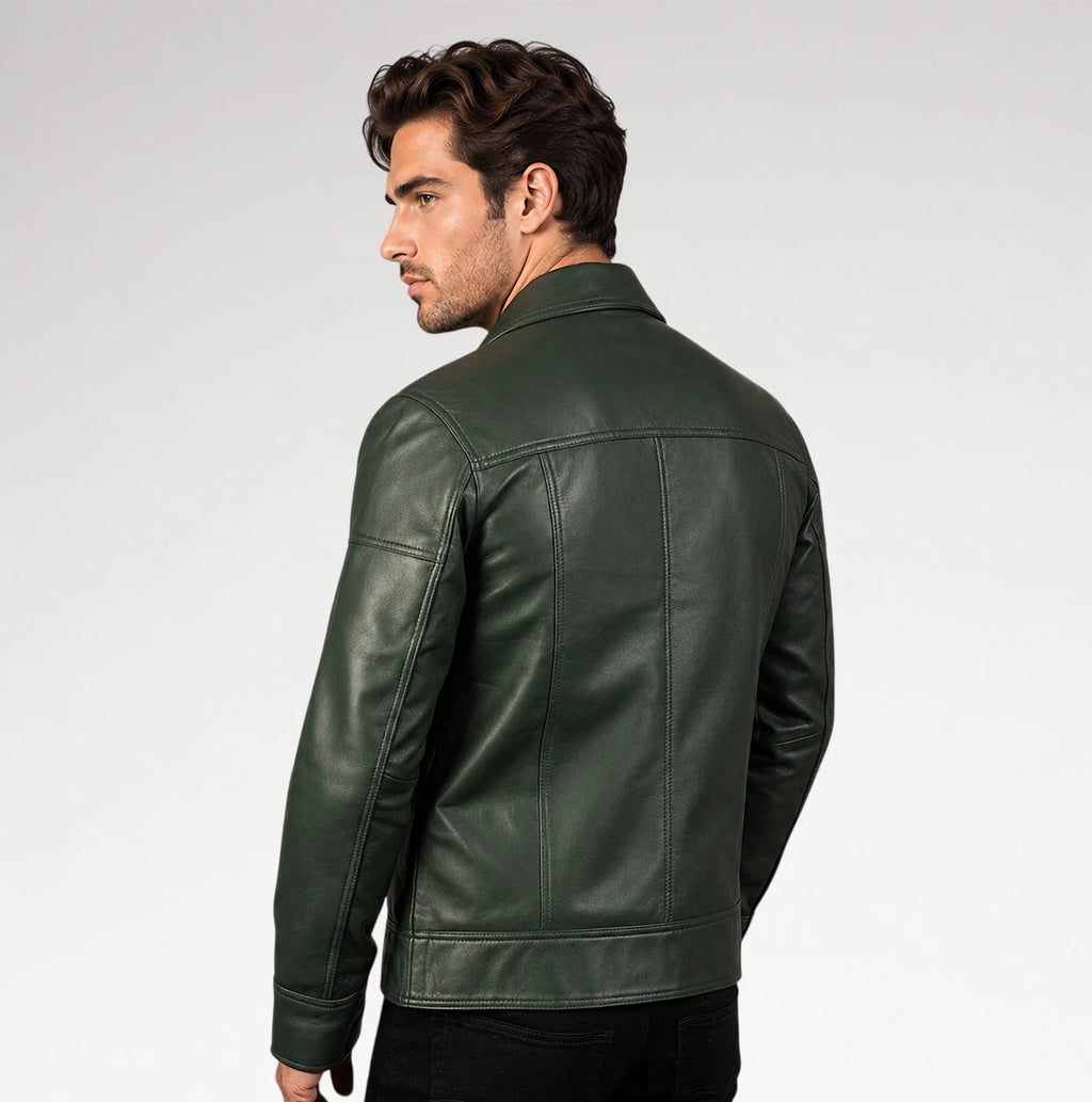 A man wearing a dark green leather jacket, shown from a side-back angle against a light gray studio background.