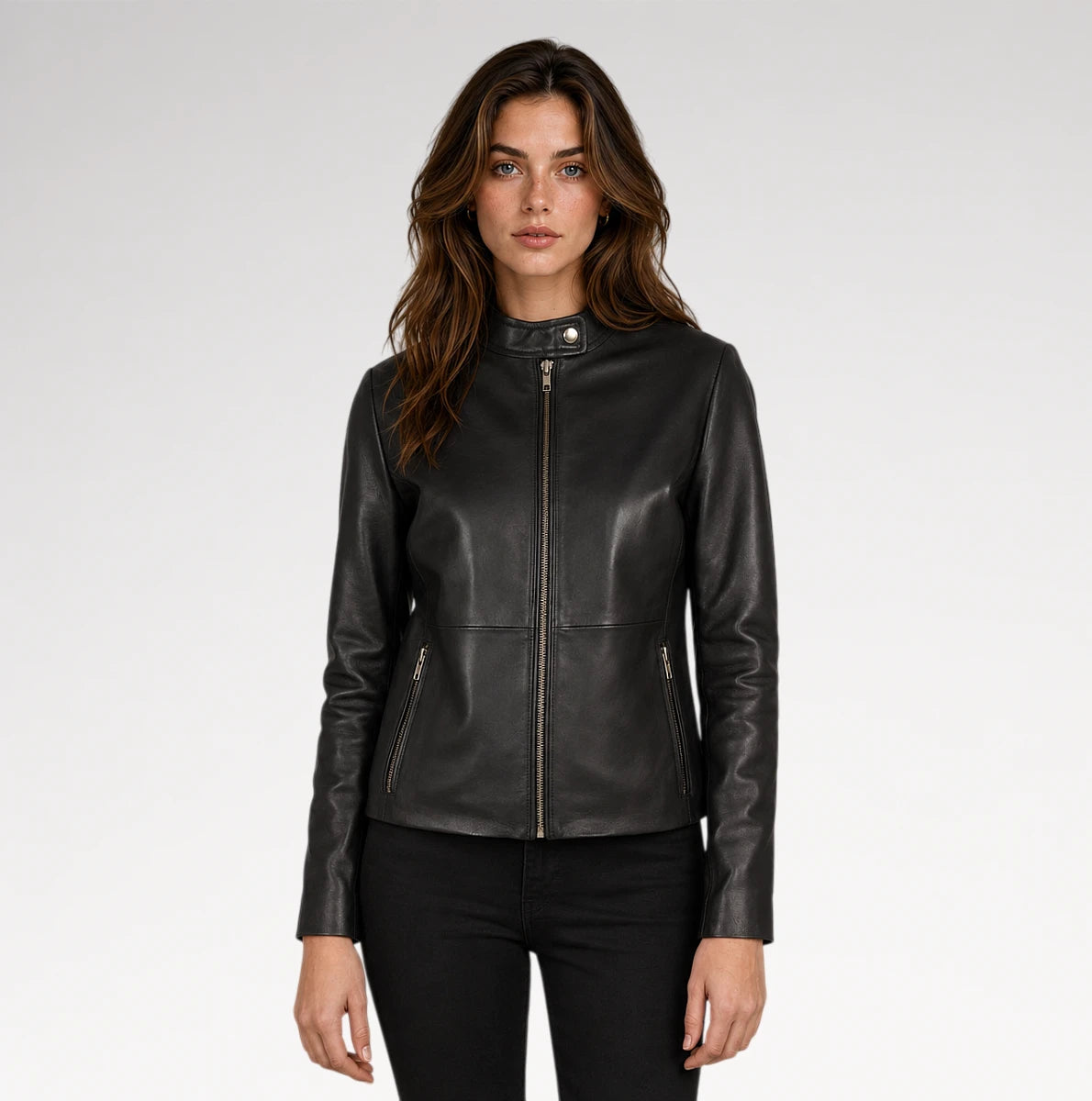 A woman modeling a black faux-leather moto jacket over a black top and black skinny jeans, paired with black ankle boots, against a plain white studio background. Main image