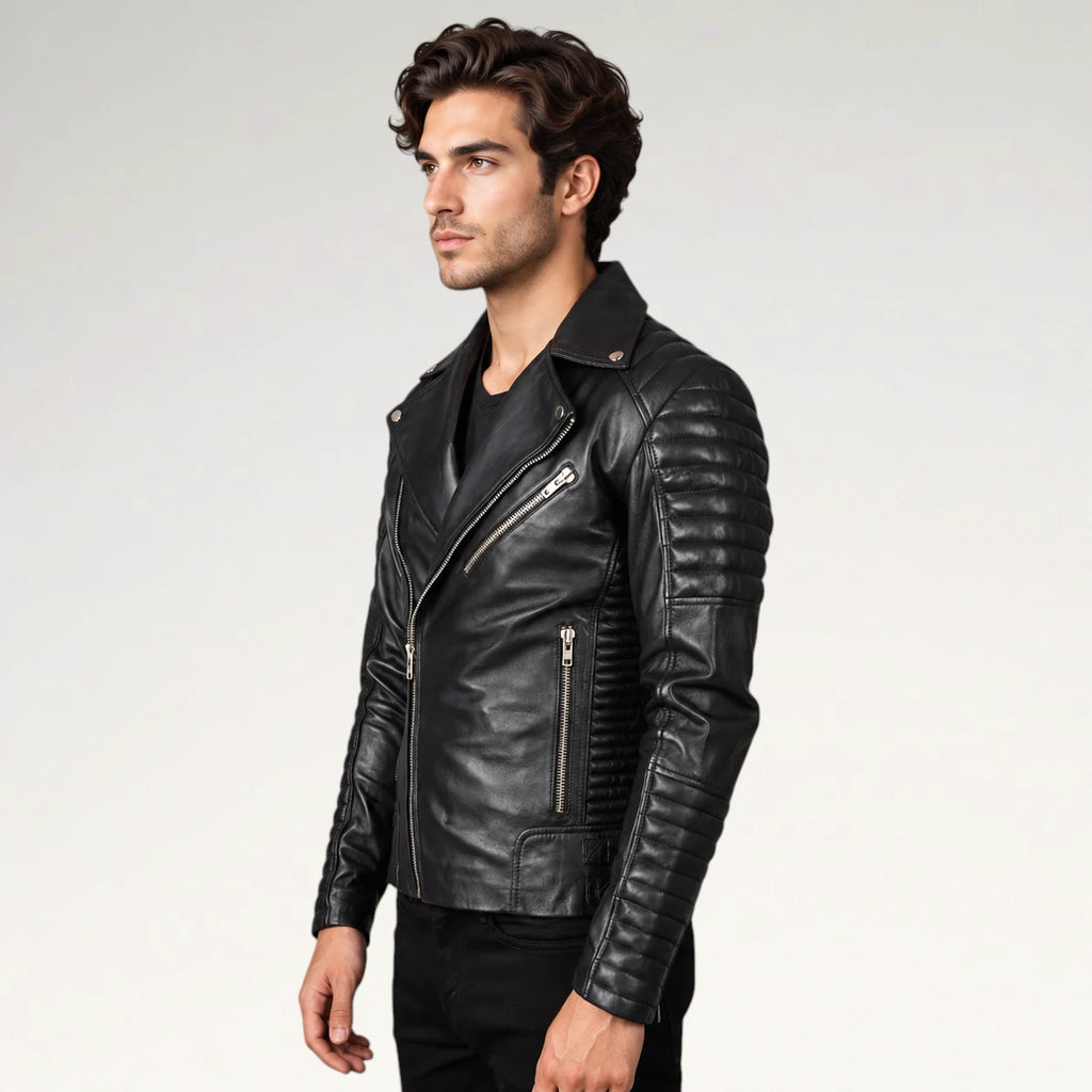 A man wearing a black leather biker jacket with silver zippers, shown in a side profile against a light gray studio background.