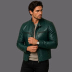 Man wearing a green leather jacket against a beige background
