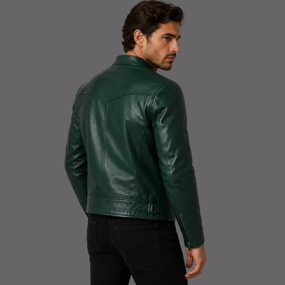 Man wearing a green leather jacket against a plain background