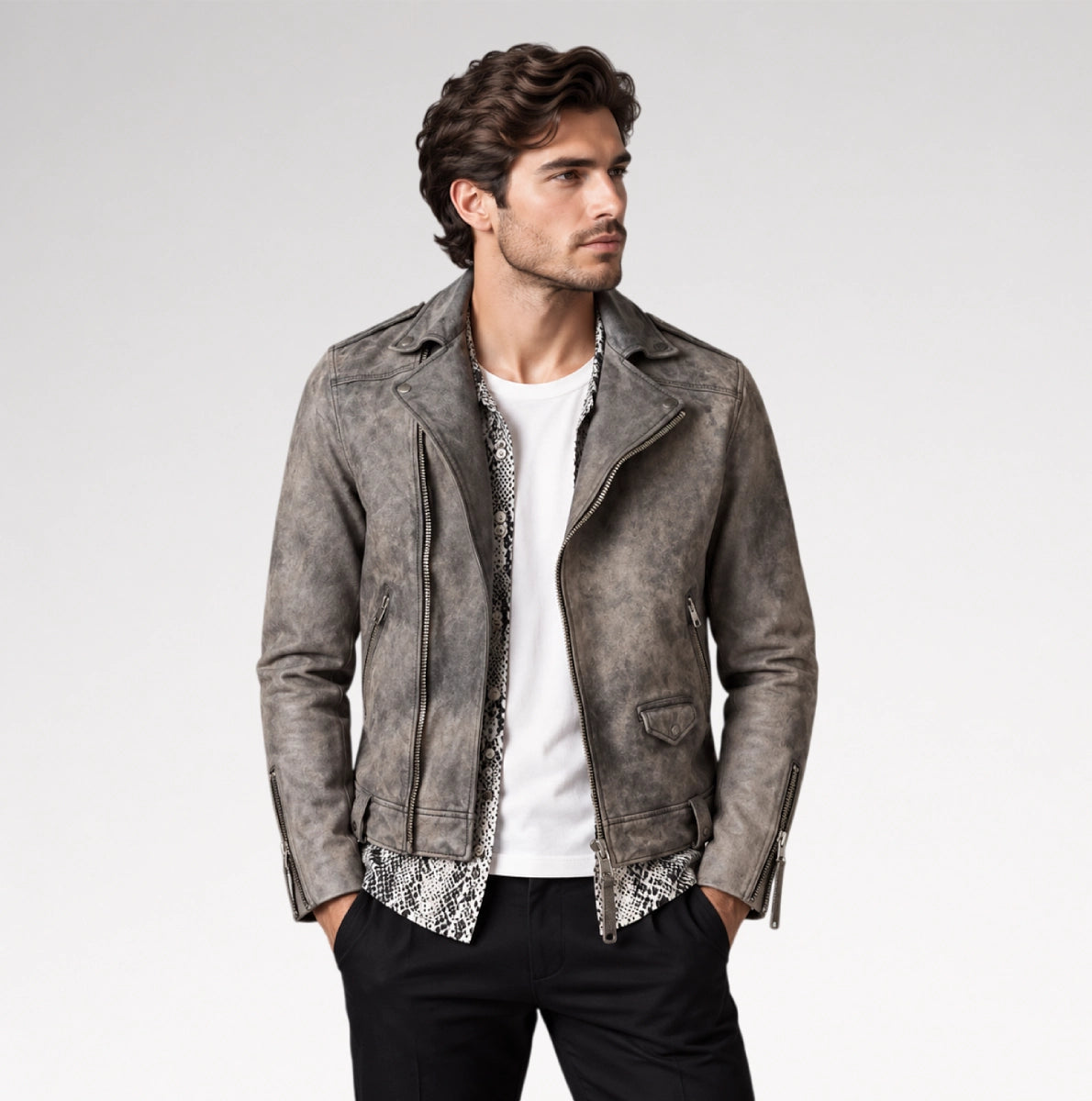 A man wearing a distressed gray faux-leather moto jacket over a white t-shirt and black pants, standing against a light gray studio background. Main image