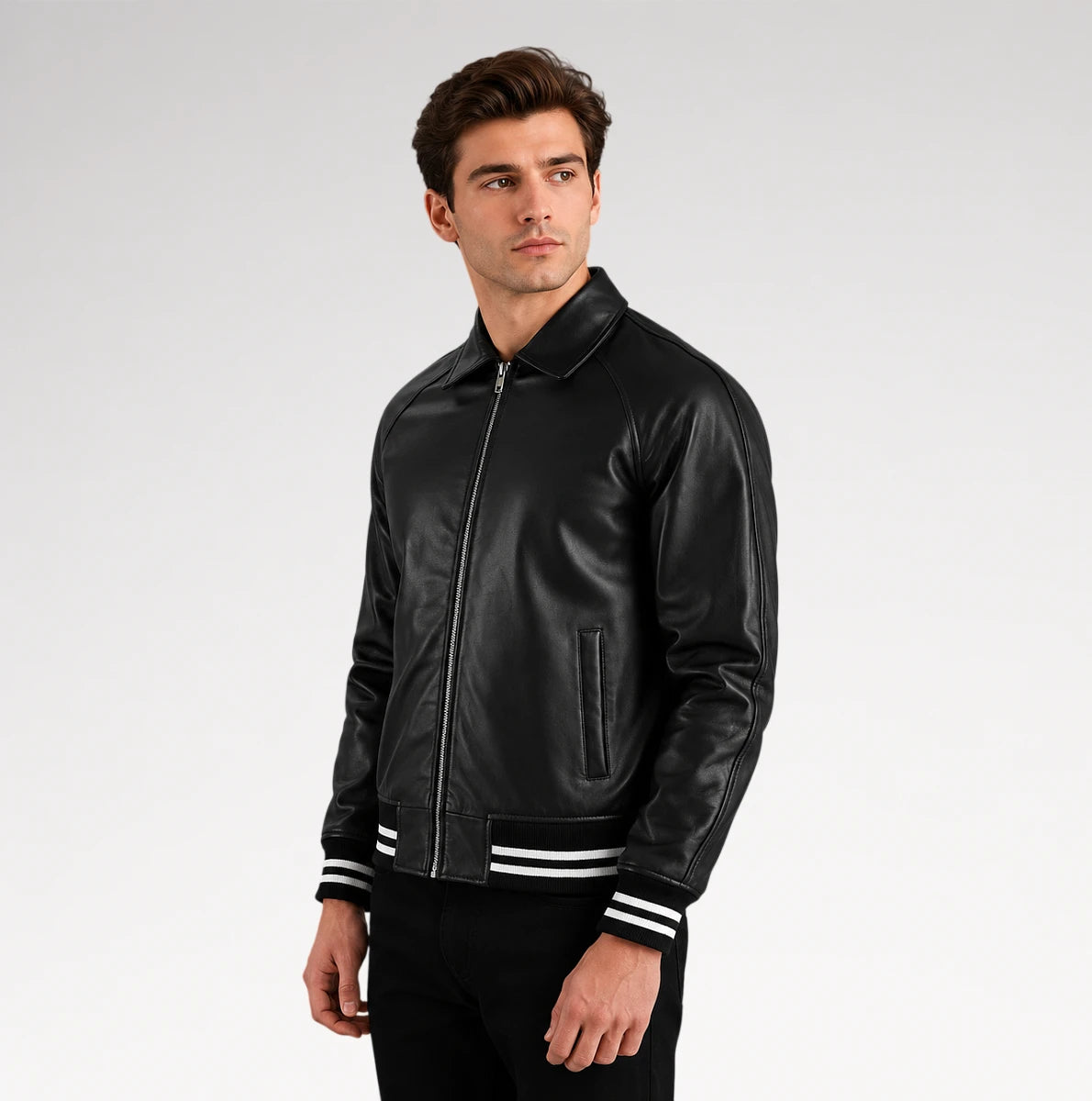 A man wearing a black leather bomber jacket with white stripes on the cuffs, posed against a light gray studio background. Main image