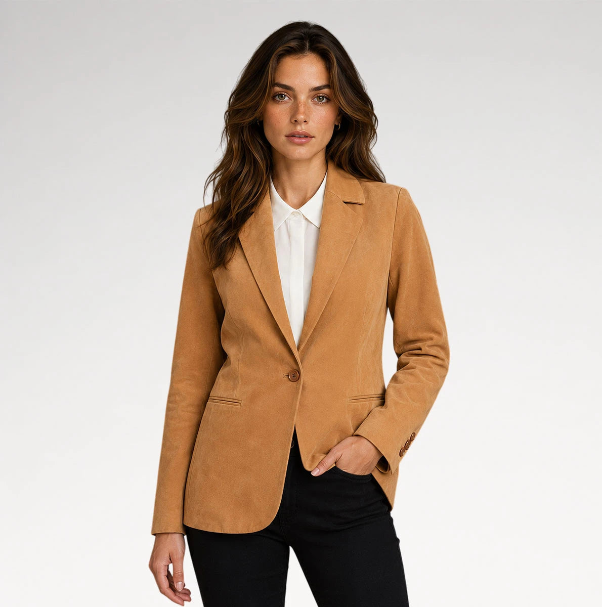 A woman modeling a camel-colored suede blazer over a white collared shirt and black pants, photographed against a clean light gray studio background. Main image