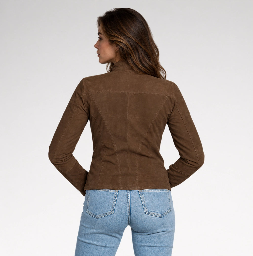 A girl is wearing dark brown suede leather jacket with a back pose on grey background.