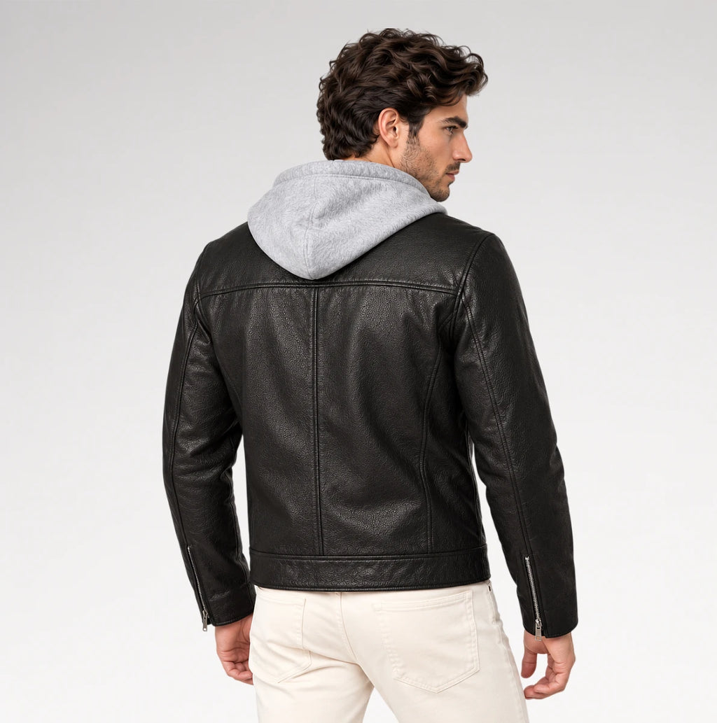 A man wearing a black faux-leather moto jacket with a light gray hood, shown from the back against a light gray studio background.